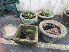 Four concrete garden pots and a birdbath top