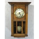 German oak cased eight day wall clock, strikes on the hour and half hour, working order