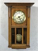 German oak cased eight day wall clock, strikes on the hour and half hour, working order