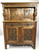 Court cupboard with two drawers and four cupboards in heavily carved American oak by furniture maker