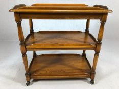 Ercol three tier tea trolley supported on castors, approx 79cm x 48cm x 79cm tall