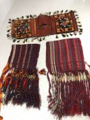 Three fringed and tasselled Eastern, possibly Turkish. donkey or camel saddle bags / blankets