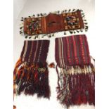 Three fringed and tasselled Eastern, possibly Turkish. donkey or camel saddle bags / blankets