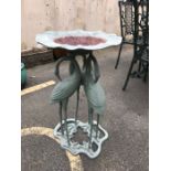 Green metal garden birdbath supported by three cranes, approx 74cm in height