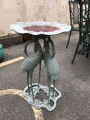 Green metal garden birdbath supported by three cranes, approx 74cm in height