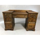 Small desk / dressing table with seven drawers and carved detailing, approx 120cm x 49cm x 73cm