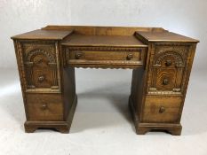 Small desk / dressing table with seven drawers and carved detailing, approx 120cm x 49cm x 73cm