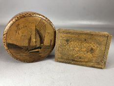Two small carved wooden boxes, one circular with a sailing scene and inscribed 'Royan', approx
