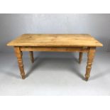 Farmhouse pine kitchen table on turned legs (missing drawer), approx 82cm x 153cm x 77cm tall