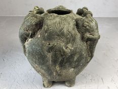 Rustic clay urn on four feet with applied elephant head decoration, approx 16cm in diameter and 16cm