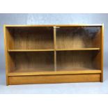 Mid Century four compartment bookcase with glass sliding doors, approx 124cm x 28cm x 75cm tall