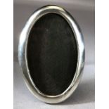 Oval Silver Antique frame with wooden back and stand approx 15 x 10cm