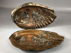 Pair of Japanese copper dishes or trays depicting samurai on horseback, each approx 23cm in length