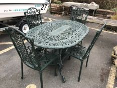 Green painted oval garden table and four chairs, table approx 138cm in length