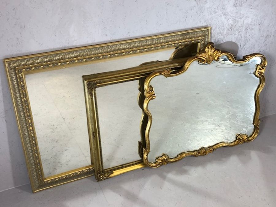 Three gilt framed mirrors, the largest approx 74cm x 106cm