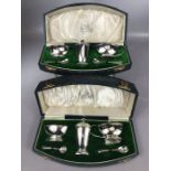 Pair of cased and matching condiment sets both hallmarked Silver and each with Salt, Mustard, Pepper