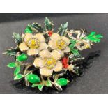 Silver and Hand painted Brooch depicting a Xmas wreath with flowers and holly approx 7cm in length