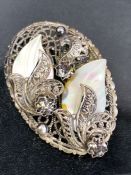 Two Mother of Pearl leaves mounted on an Oval Filigree silver Brooch approx 57mm