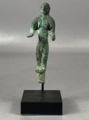 Luristan votive figurine modelled in bronze depicting a nude male figure with forearms extended,