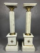 Pair of white marble plinths / pillars with gilt decoration, each approx 99cm in height