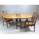Mid Century drop leaf oval table and two carver chairs, all by NATHAN, table approx 167cm x 98cm