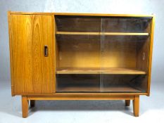 Mid Century bookcase with glass sliding doors and shelved cupboard, approx 107cm x 26cm x 82cm tall