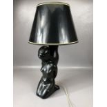 Retro / vintage black ceramic table lamp in the form of a kneeling women with black and gold