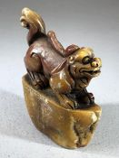 Chinese soapstone seal decorated with a figure of a dog, approx 8cm in height