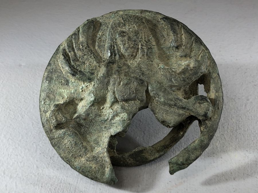 Bronze applique depicting the Gorgon Medusa, fragmented, approx 8cm in diameter