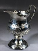 Silver hallmarked George III cream jug London 1773 on pedestal foot with floral decoration approx