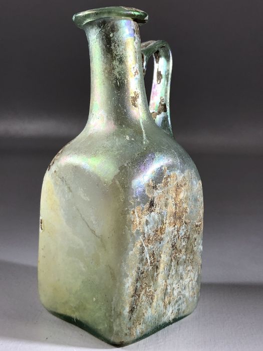 Square glass bottle, possibly Roman, in translucent blue/green glass, cylindrical neck very slightly - Image 3 of 11