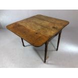 Antique oak pembroke table with single drawer on turned legs with original castors, approx 92cm in