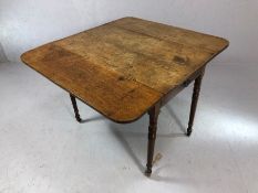 Antique oak pembroke table with single drawer on turned legs with original castors, approx 92cm in