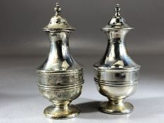 Pair of silver Salt & pepper cruets (weighted bases) approx 9cm tall approx 141g