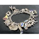 Silver Charm Bracelet with over 25 charms including coins