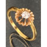 18ct Gold Diamond (approx .33ct) ring set in a raised starburst design size 'O'