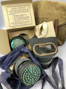 Military interest: Two WWII Gas masks, one in original box, along with a canvas WWI bag marked '