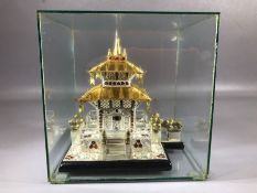 Eastern Temple contained in Glass case decorated in Silver and Gold with red and blue decoration