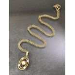 9ct Gold chain with Oval 9ct Gold pendant set with small diamonds and Pearl to centre. Chain