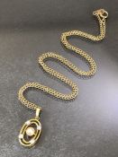 9ct Gold chain with Oval 9ct Gold pendant set with small diamonds and Pearl to centre. Chain