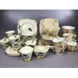 Collection of Art Deco tea ware: A Tuscan Plant part tea set in green, black and gilt to include six