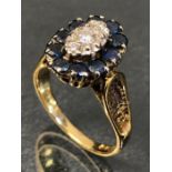 18ct Gold Marquise style Diamond and Sapphire set with 10 Sapphires and a central Diamond