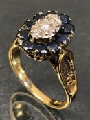 18ct Gold Marquise style Diamond and Sapphire set with 10 Sapphires and a central Diamond