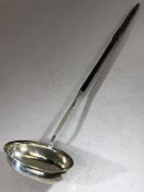 Georgian Silver Punch ladle hallmarks rubbed but maker T.M over length 38.5cm with twisted