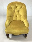 Upholstered nursing chair on original castors in gold fabric, approx 77cm in height