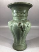 Green crackle glazed Chinese vase with rams head design and widely flared neck, approx 22cm in