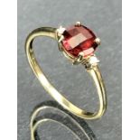 9ct Gold ring set with a red faceted Garnet Gemstone (approx 6mm in Diameter) size 'O'