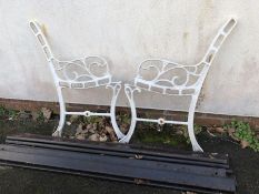 Pair of small white metal bench ends and wooden slats (A/F)