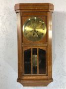 Brass faced wall clock, gongs on the hour and half hour, circa 1950s, working order