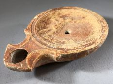 Roman oil lamp with depiction of two gladiators, approx 10cm in length